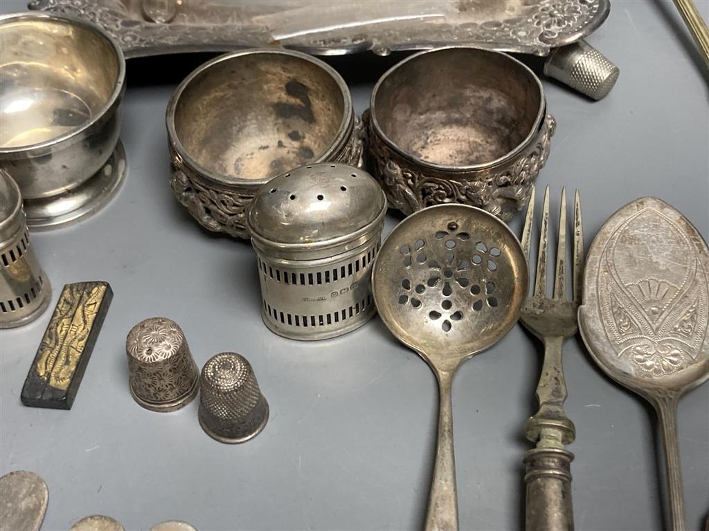 Four silver condiments, two silver thimbles, two Indian? salts and assorted plated flatware etc.